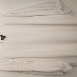3/4 sleeve white with black pin stripe accents.